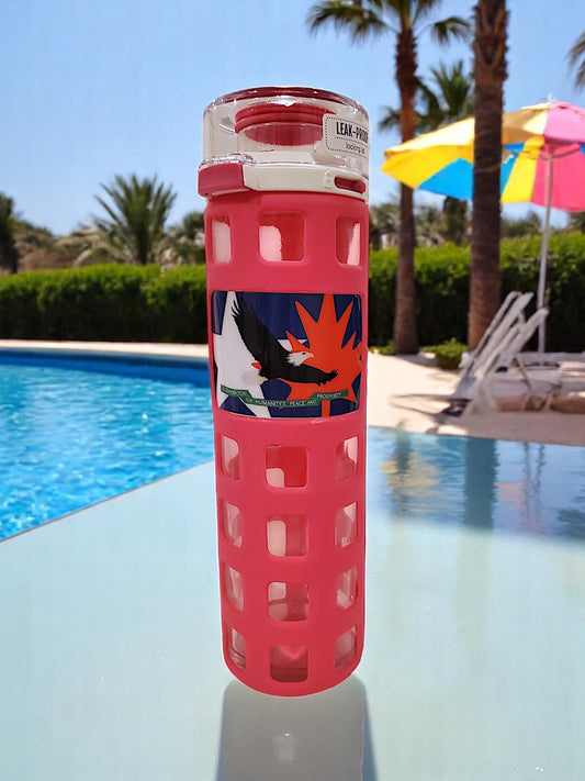 a pink glass water bottle white eagle