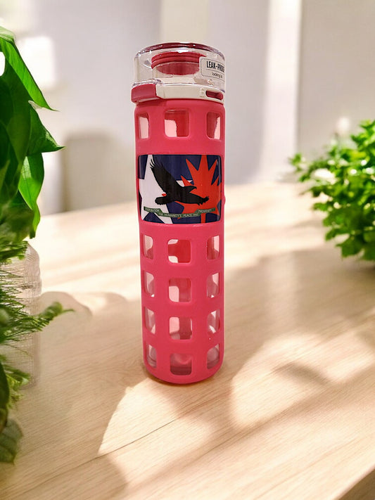 a pink glass water bottle black eagle